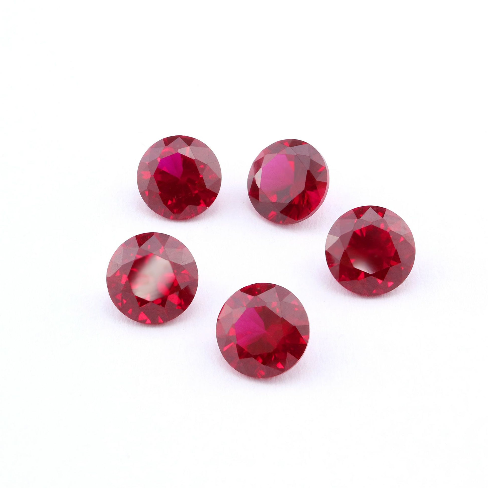 Five round cut red lab created ruby.