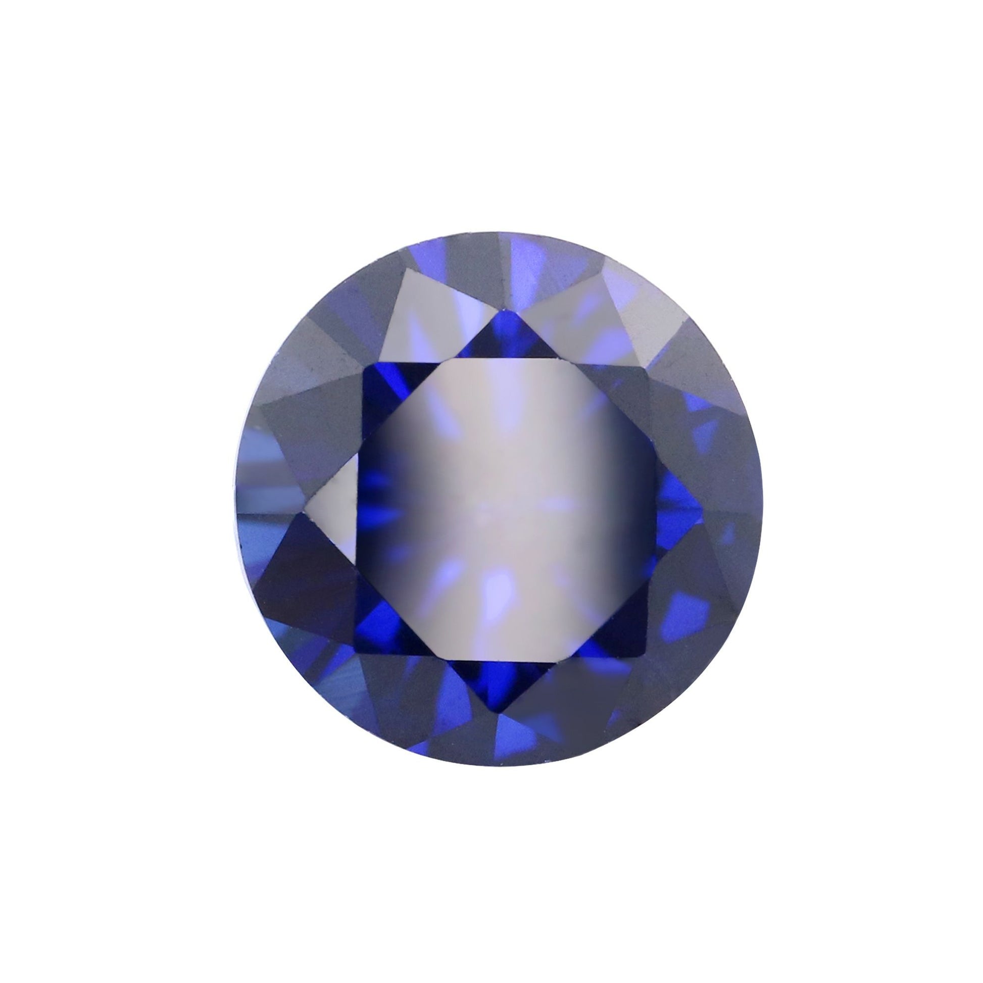 A dark blue round cut lab created sapphire.