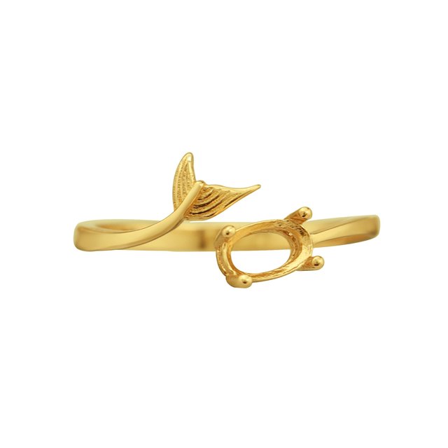 A gold oval wrap around ring with a mermaid tail on the opposite end.