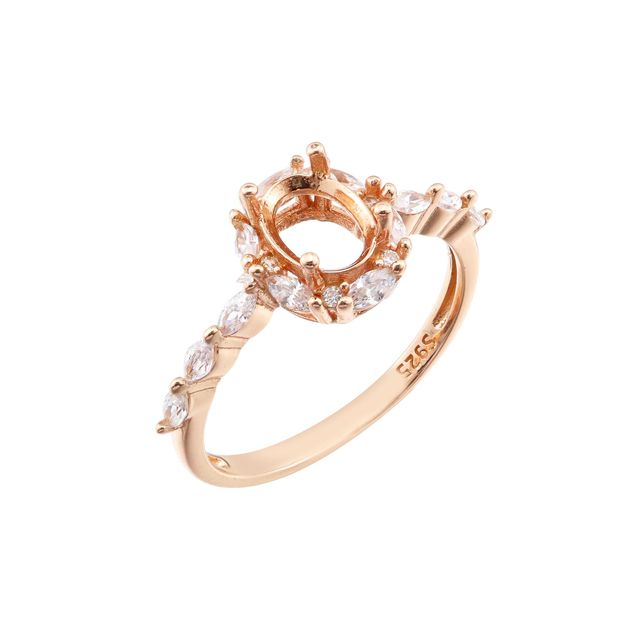 A rose gold vintage style halo semi mount with pave marquise gems.
