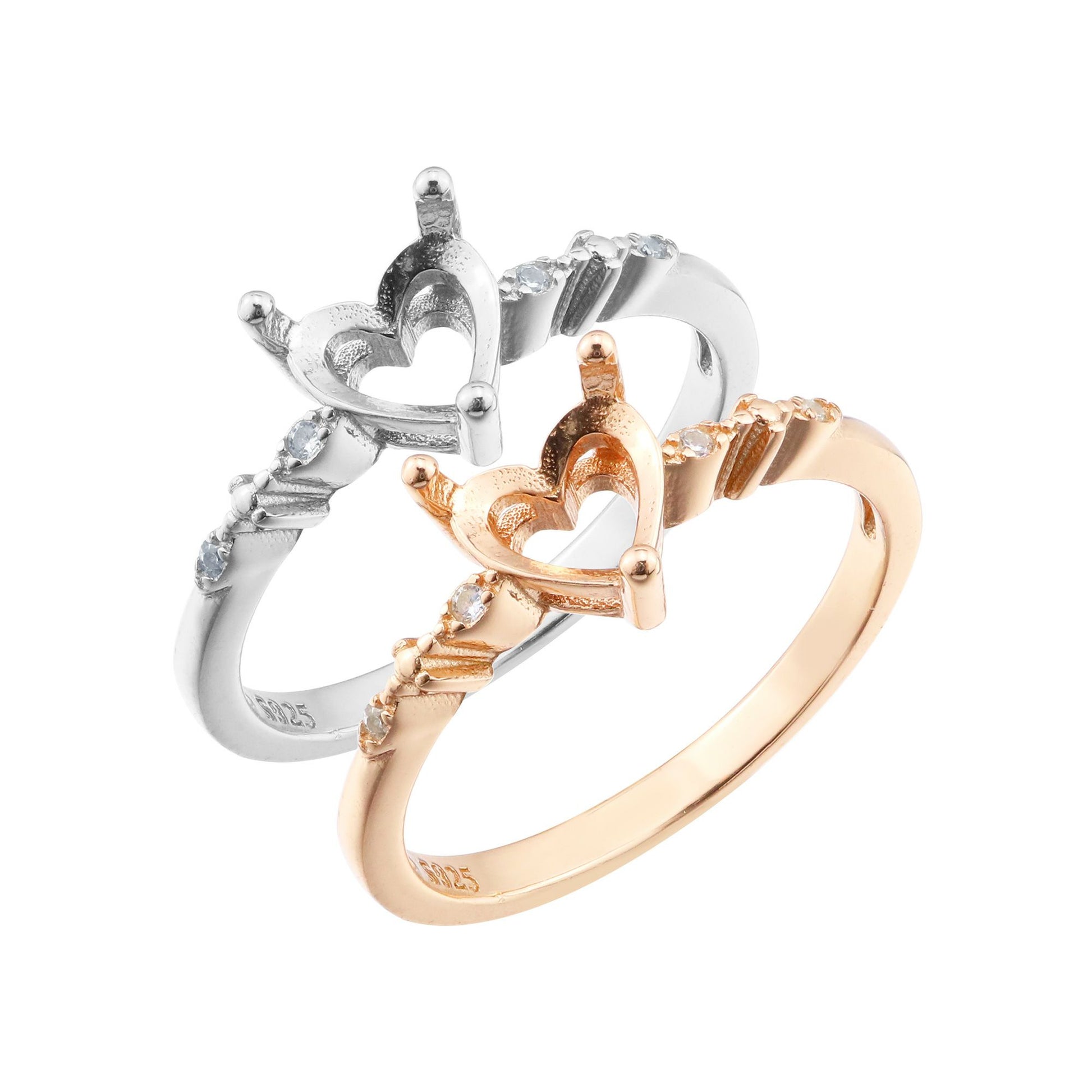 One silver and one rose gold semi mounts to fit a heart cut gem with small round accent gems on the band.