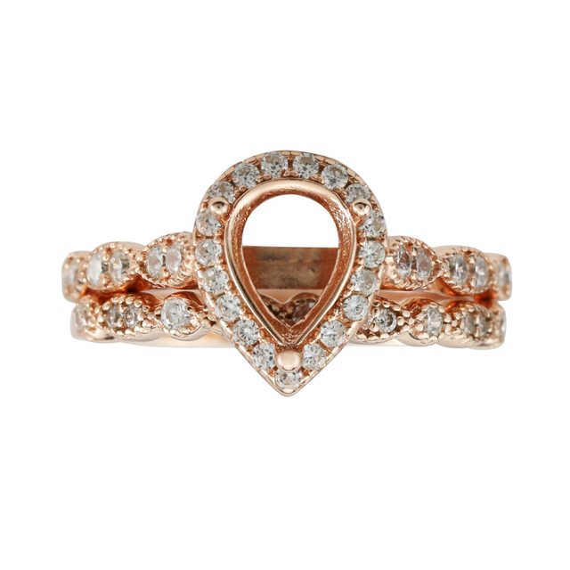 A rose gold art deco tear drop halo semi mount setting with matching wedding ring and a rose gold identical setting.