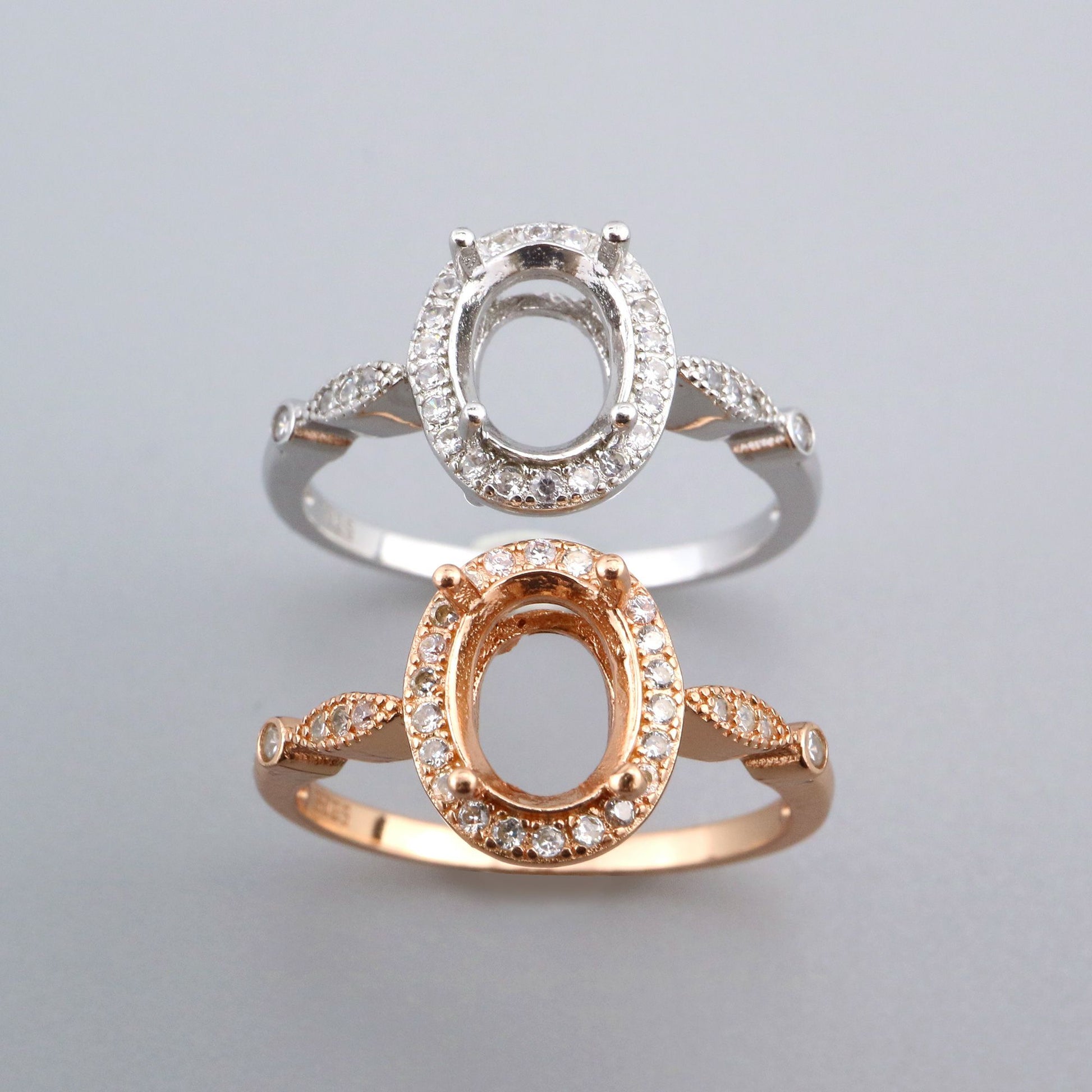 One silver and one rose gold vintage style oval semi mount.