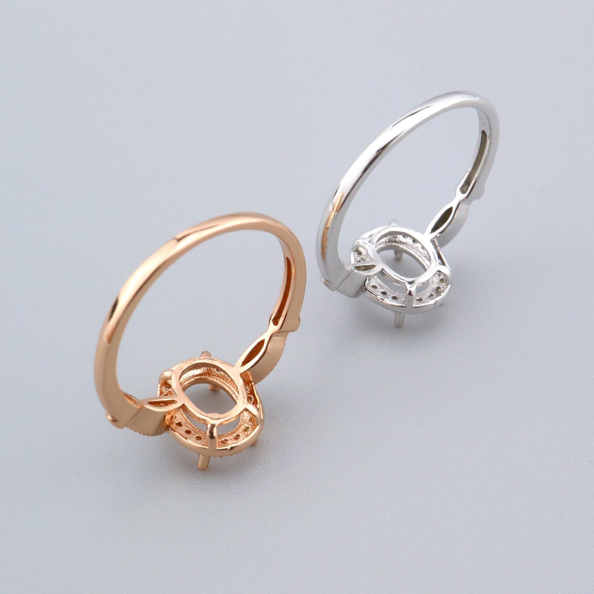 One silver and one rose gold vintage style oval semi mount.
