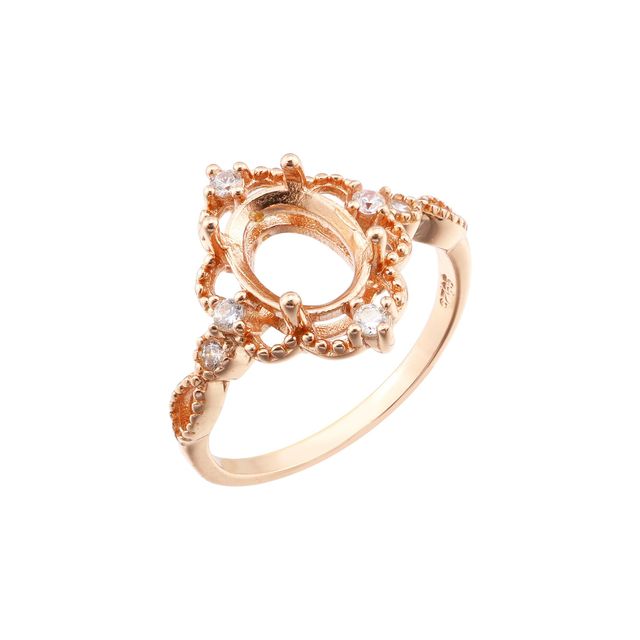 A rose gold lacey style oval vintage halo semi mount.