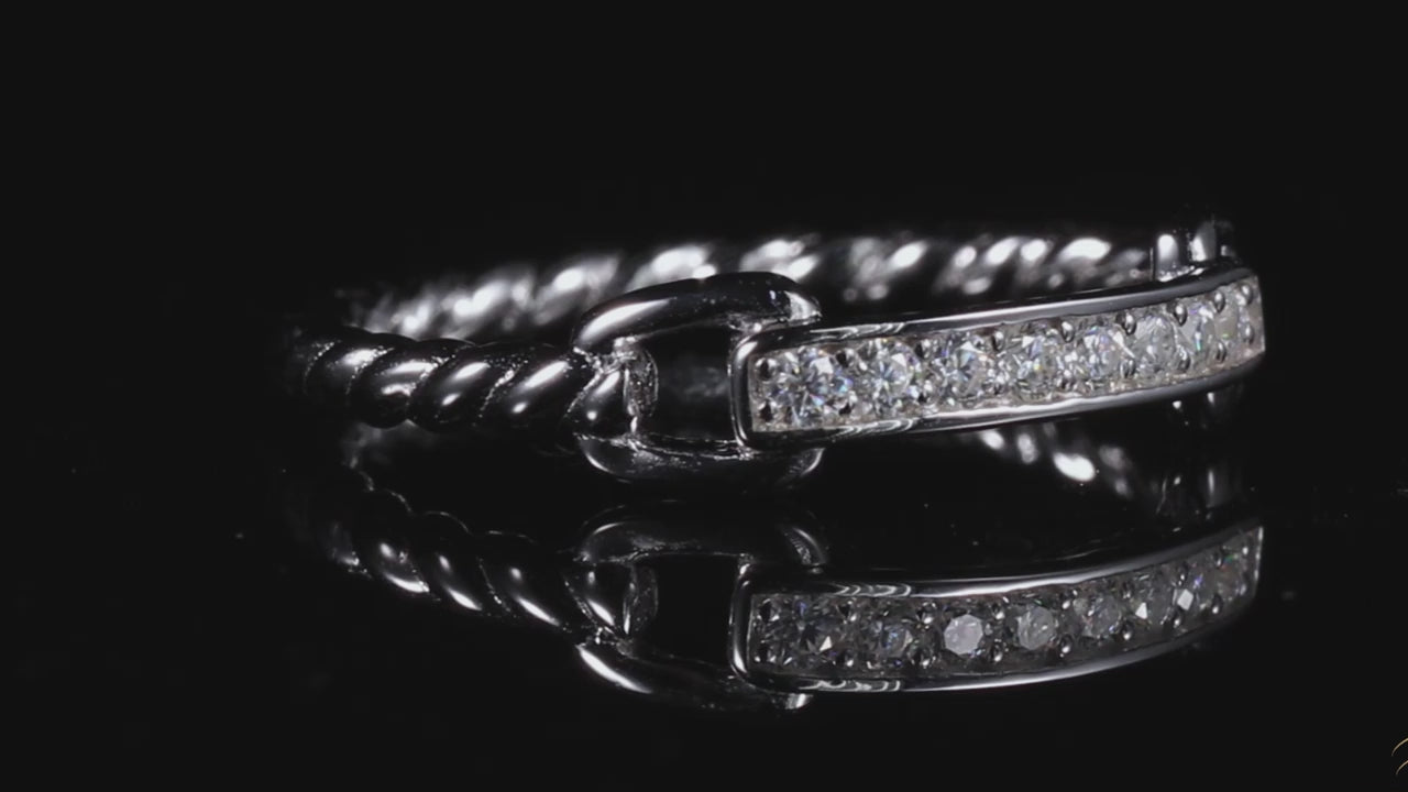 A silver chain and rope style ring set with 8 horizontally set moissanites on a spinning viewing platform.