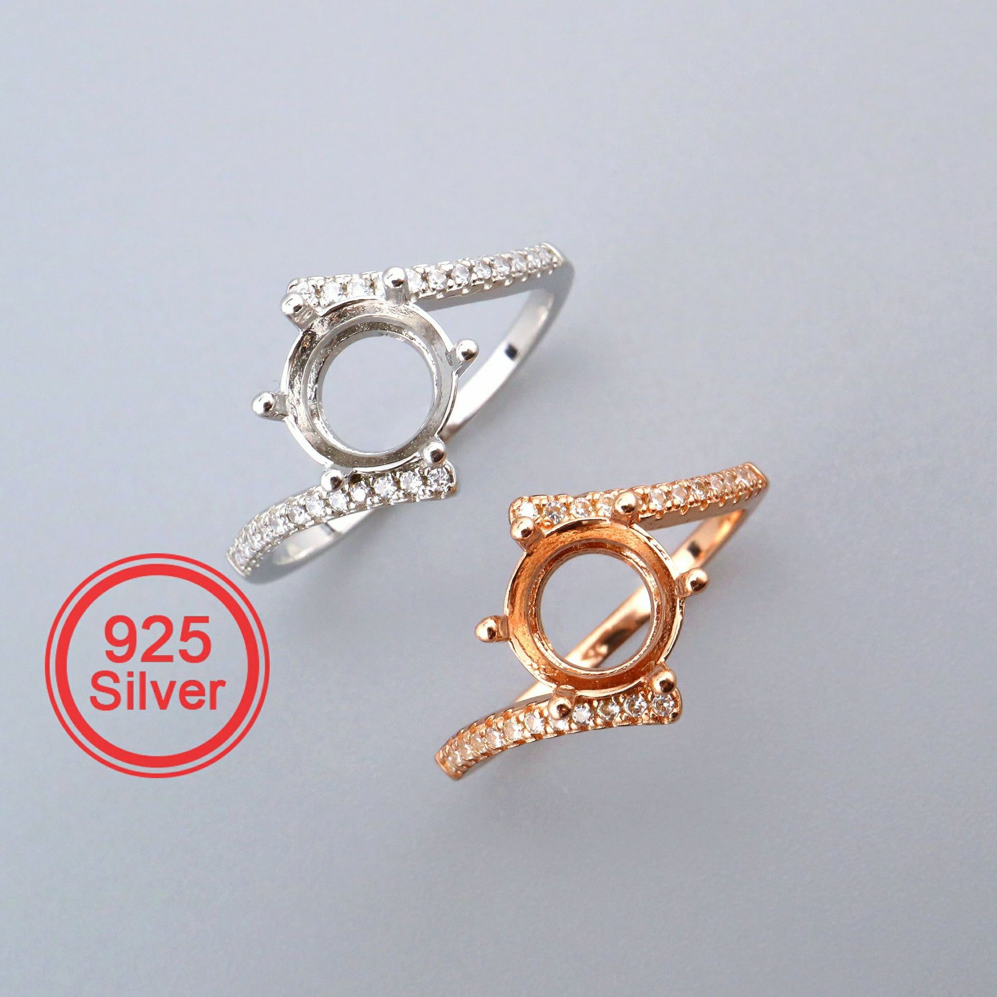 One silver and one rose gold pave bypass semi mount for a round cut gem.
