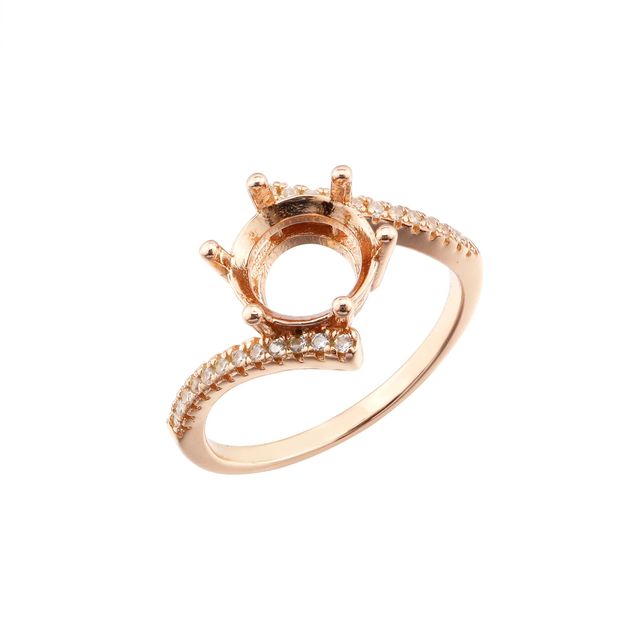 A rose gold pave bypass semi mount for a round cut gem.