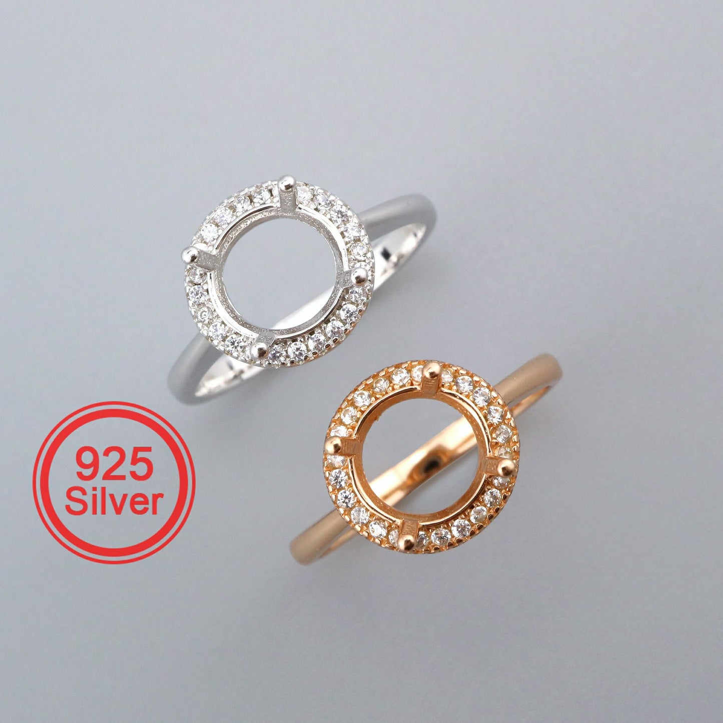One silver and one rose gold round halo semi mounts with filigree cutouts.