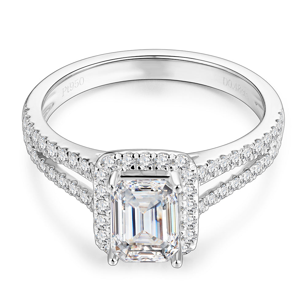 A silver ring with a emerald cut moissanite in a halo with a pave split shank.
