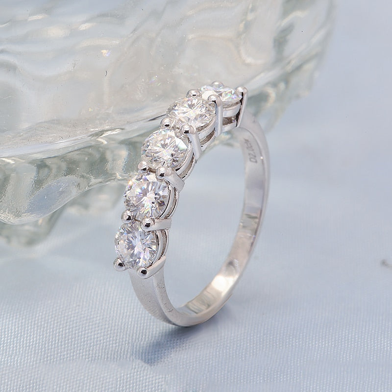 A silver 5 gem wedding ring.