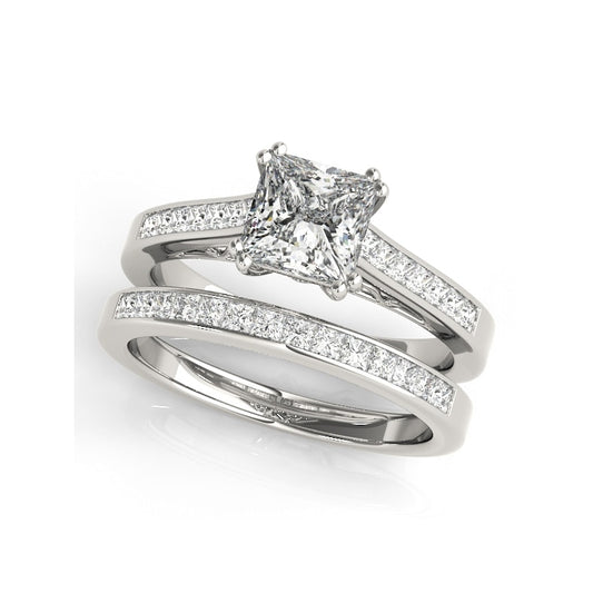 A silver engagement wedding ring set with a princess cut gem set on a filigree neck and channel set shank.