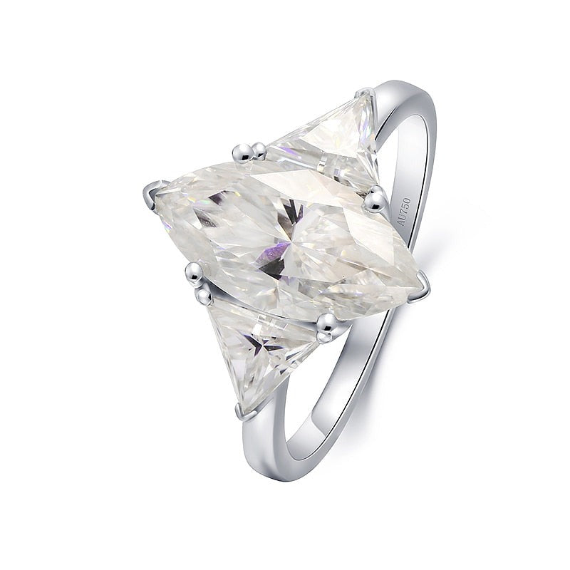 A silver 3 stone ring set with a 3CT marquise moissanite and with a 1.2CT trillion cut moissanite on each side.