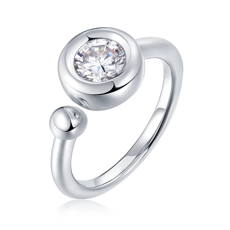 A silver exaggerated bezel set round moissanite on a "one size fits all" shank with a small ball on the opposite side.