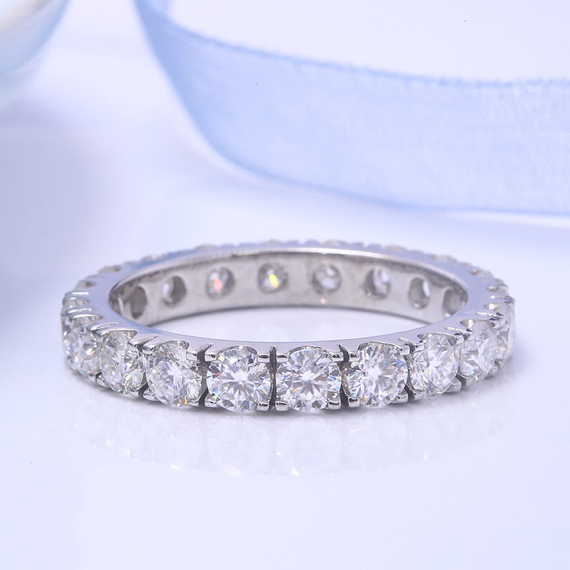 A silver full eternity wedding ring.