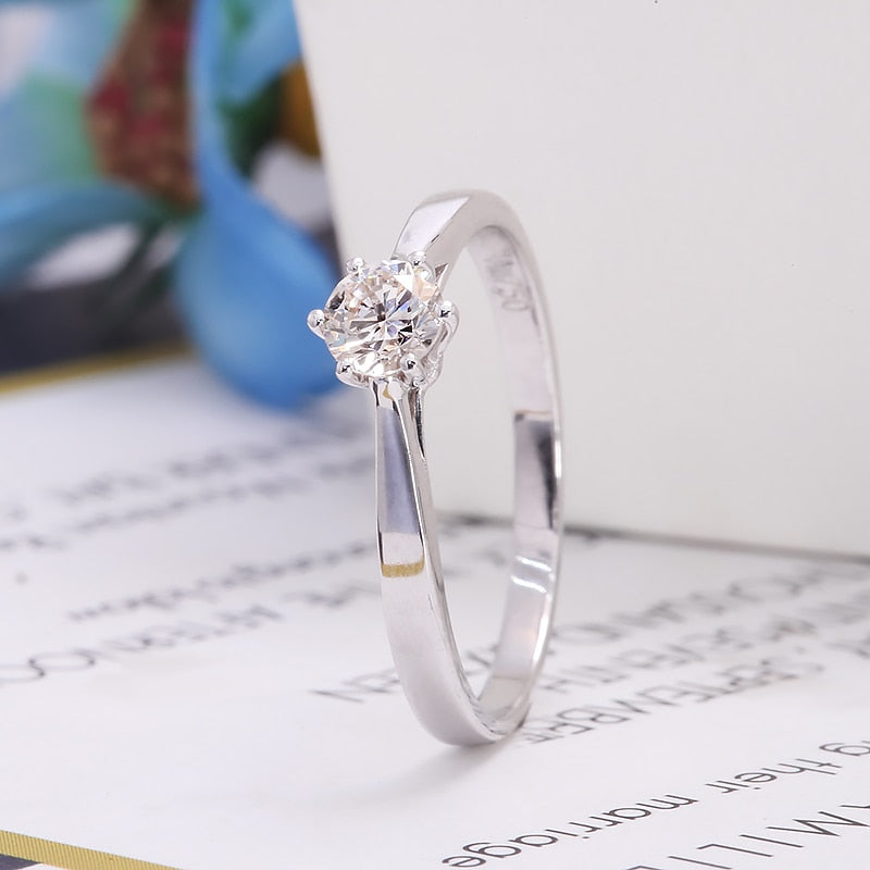 A silver small round solitaire with a tapered band.