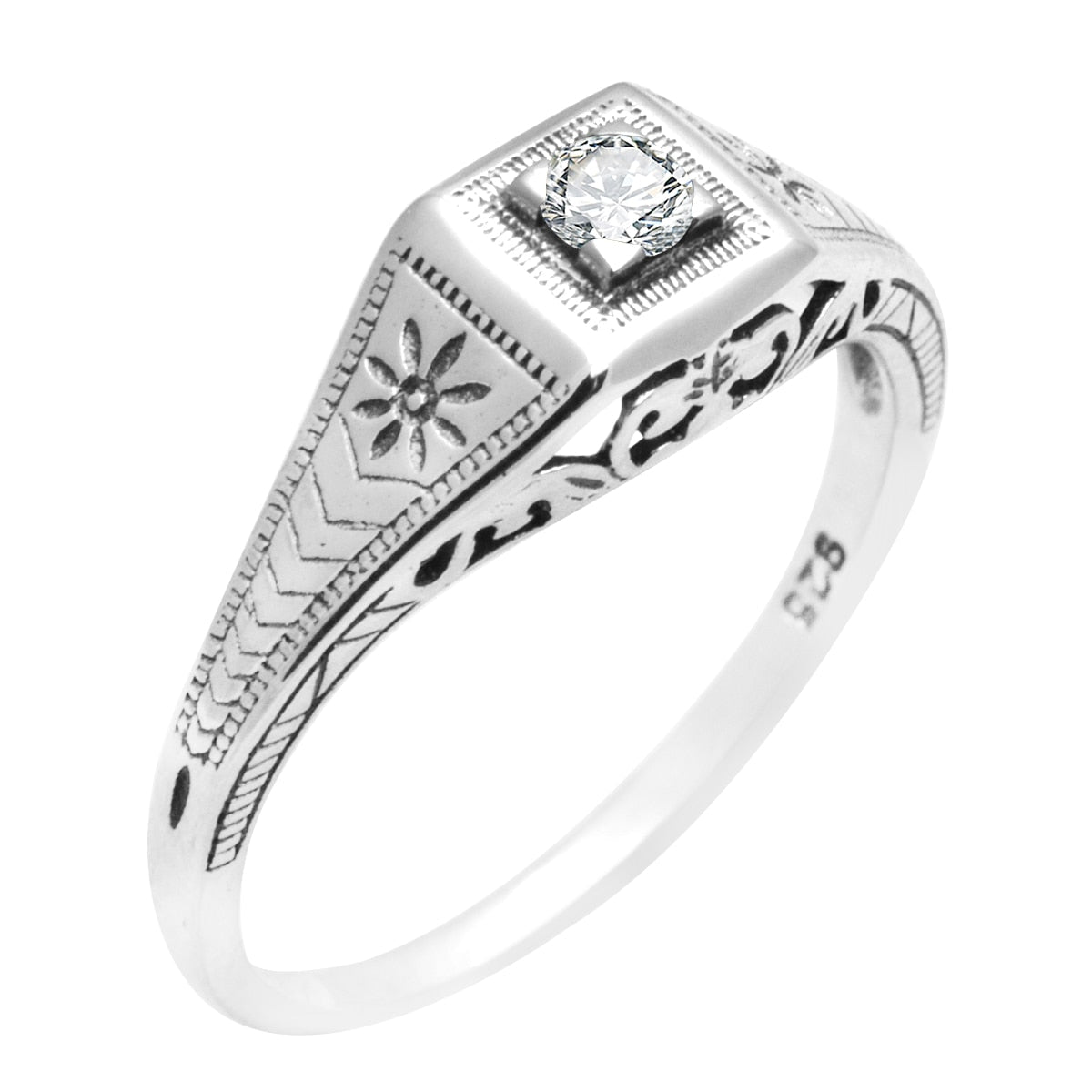 A silver vintage inspired Edwardian style ring set with a small round moissanite.