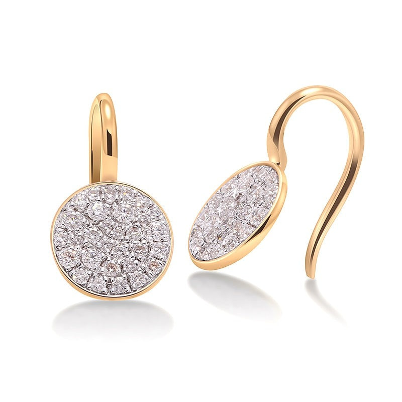 A pair of gold tone round gem encrusted drop earrings.