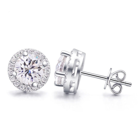 A silver pair of moissanite halo earring studs.