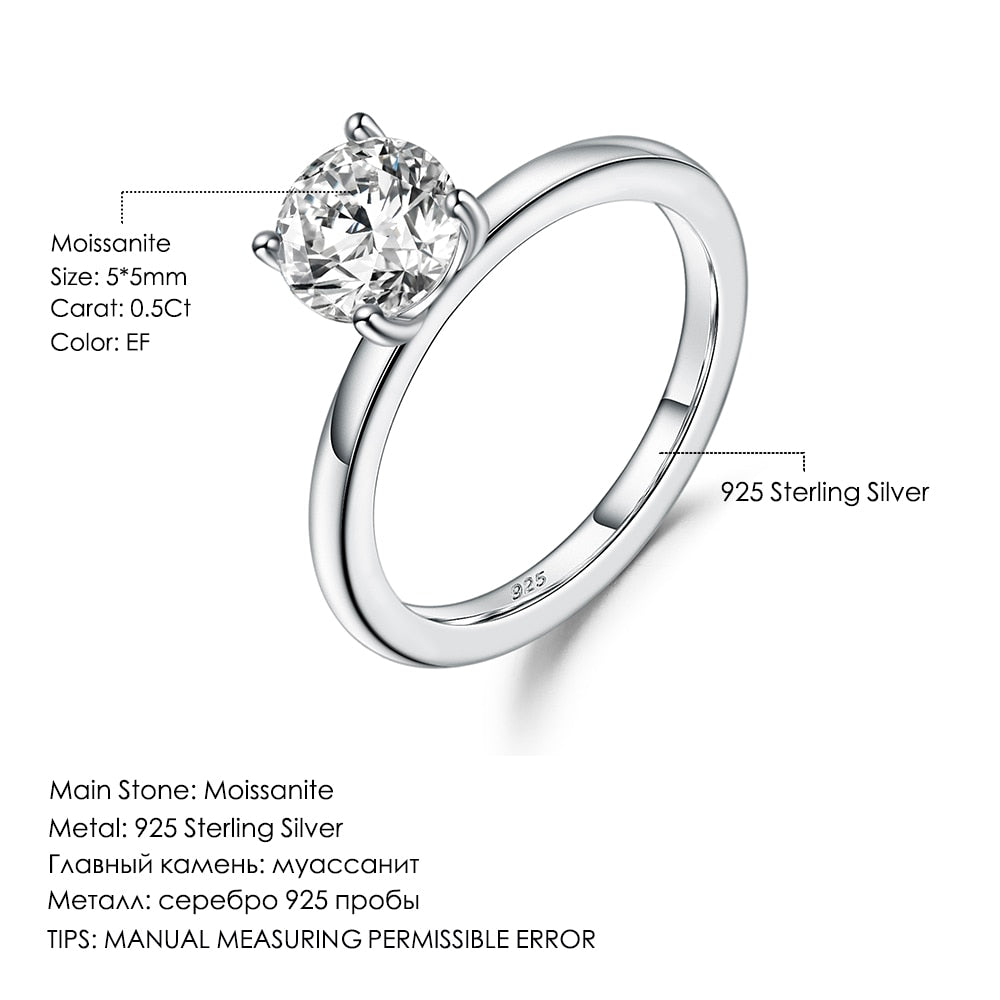 A silver 4 prong set solitaire ring.