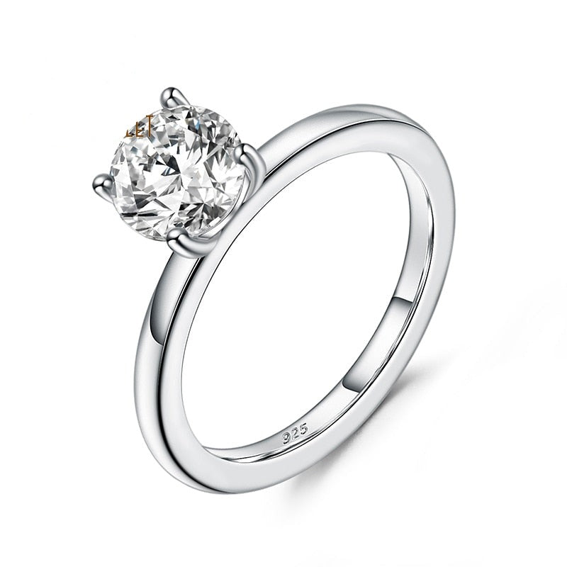A silver 4 prong set solitaire ring.