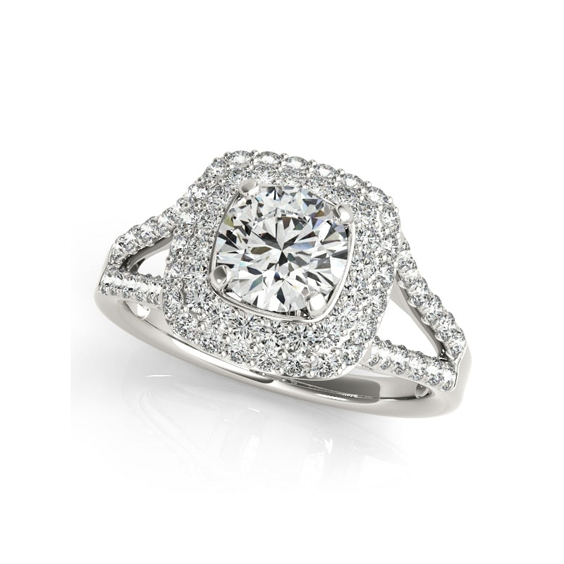 A silver ring set with a round moissanite surrounded by a squared double halo on a split pave shank..