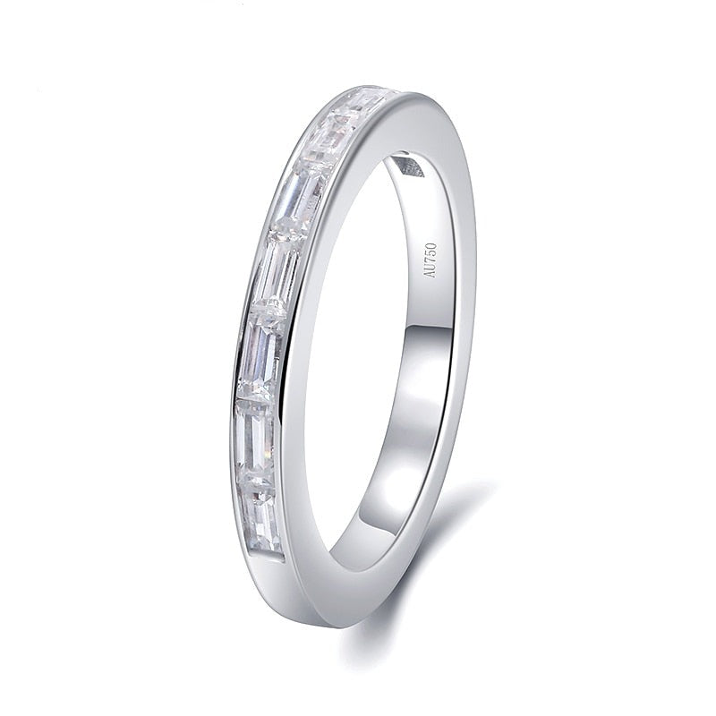A silver wedding ring channel set with 9 baguettes horizontally.