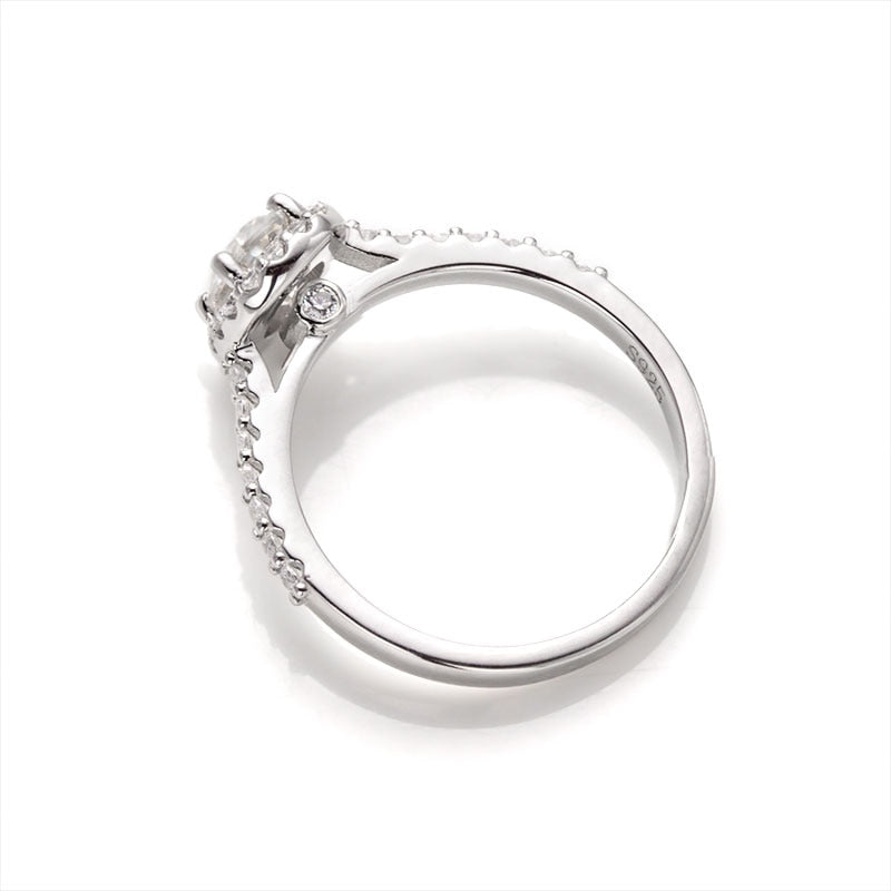 A silver oval halo ring.