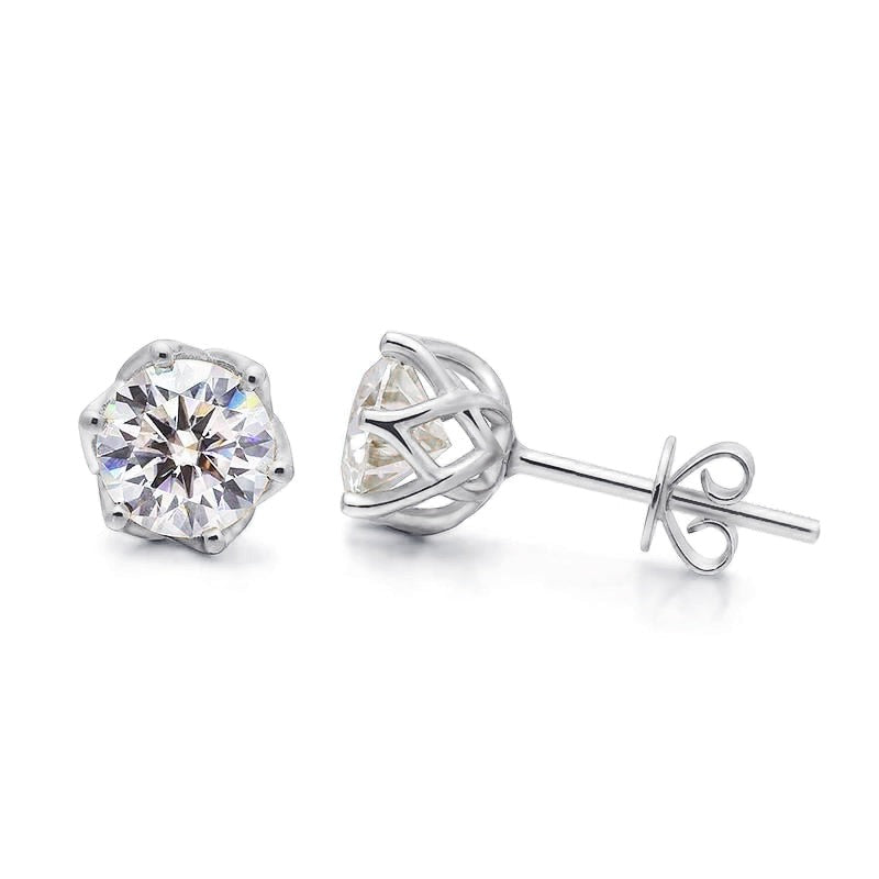 A silver pair of moissanite stud earrings.