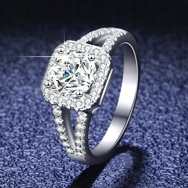 Silver pave split shank squared halo set with a round moissanite.