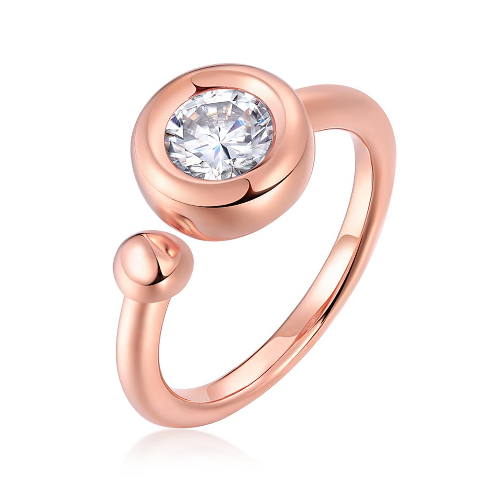 A rose gold exaggerated bezel set round moissanite on a "one size fits all" shank with a small ball on the opposite side.