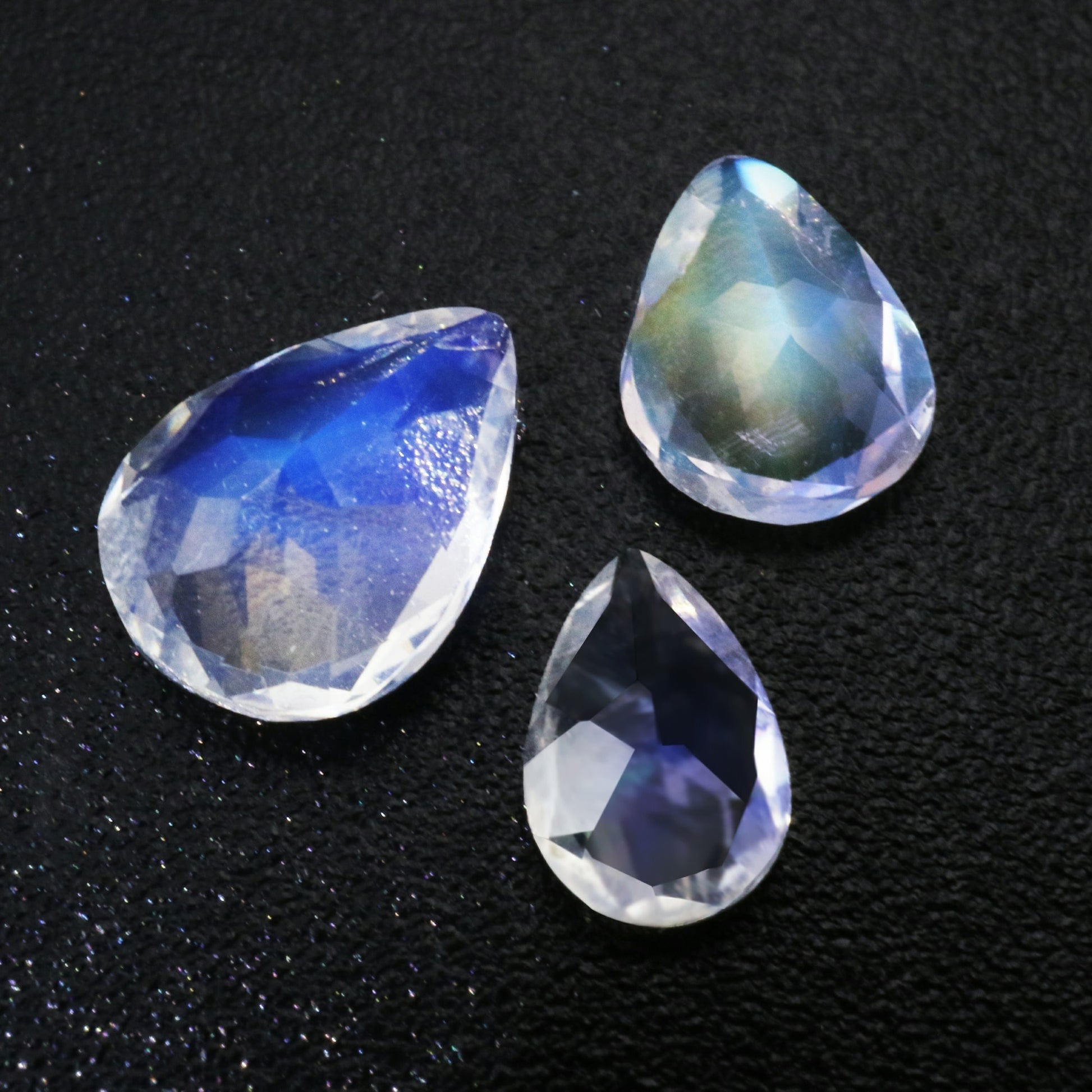 Three sparkling tear drop cut blue moonstones.