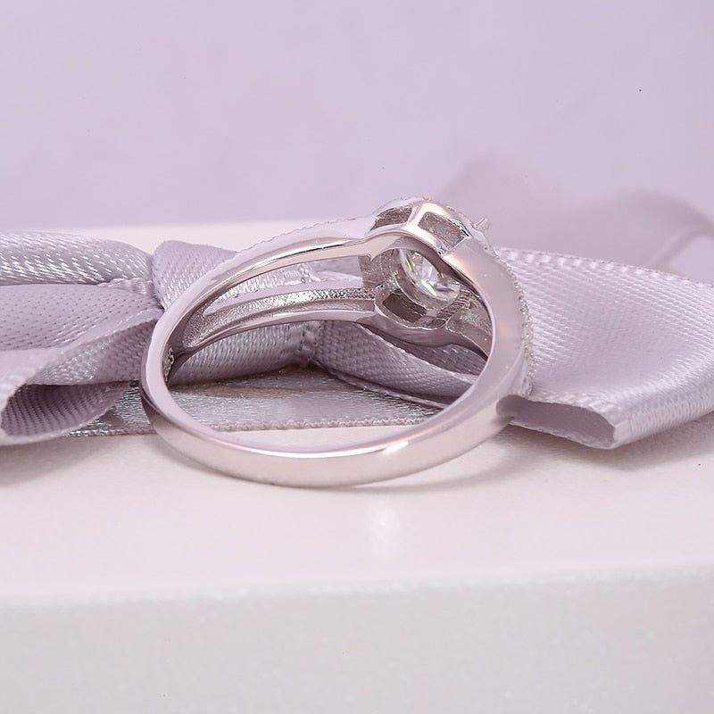 A silver round cut double band split shank ring.
