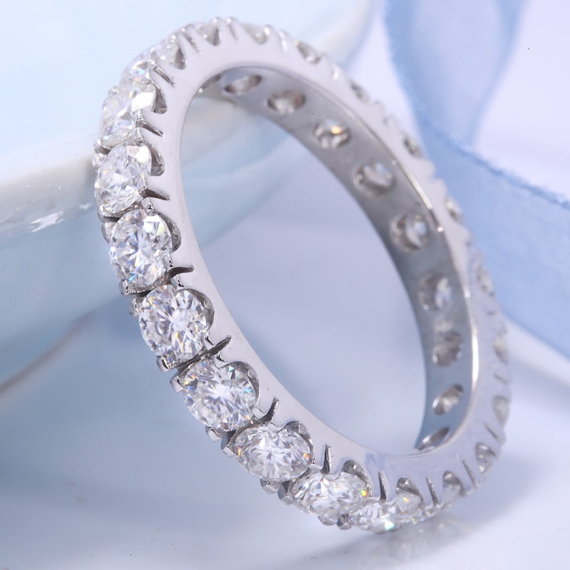 A silver full eternity wedding ring.
