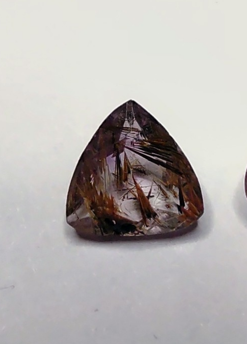A trillion cut super seven quartz gem.