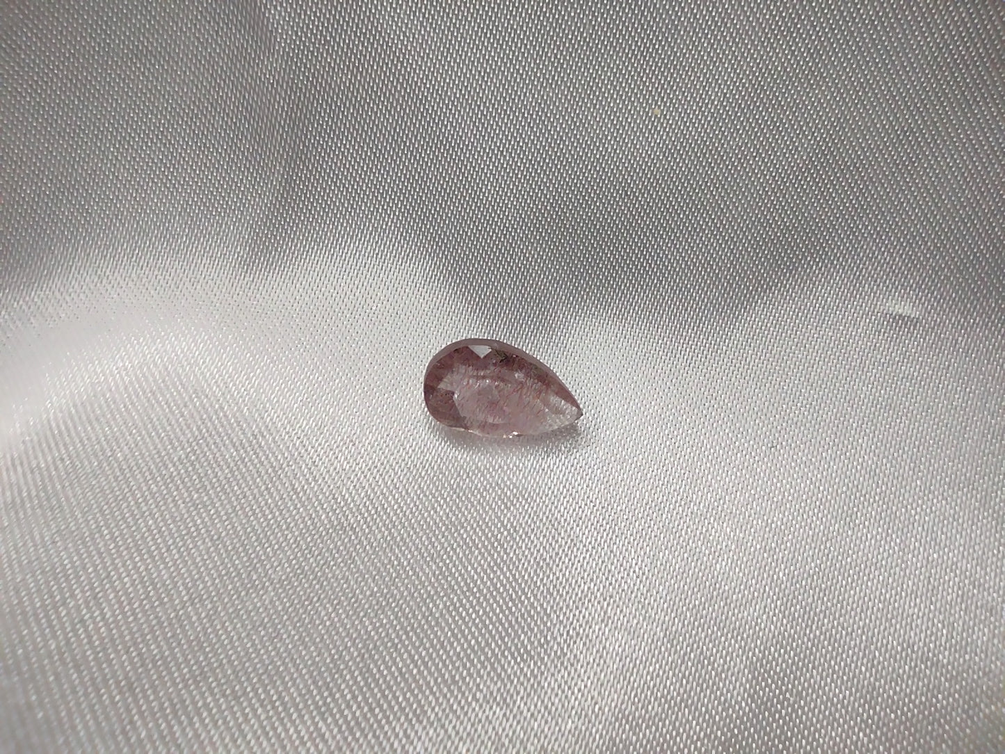 A tear drop cut super seven quartz.