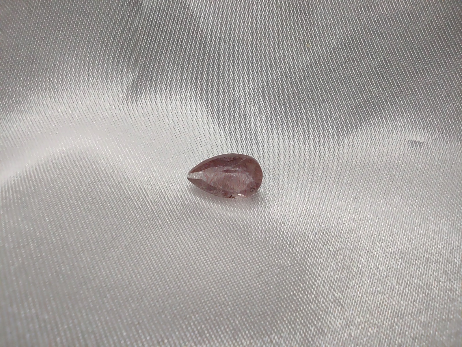 A tear drop cut super seven quartz.