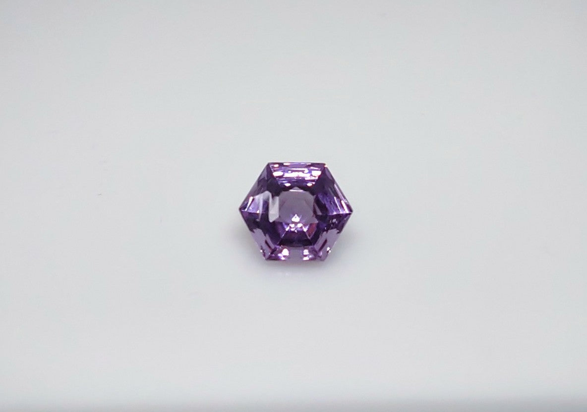 A spider web cut octagonal purple amethyst.