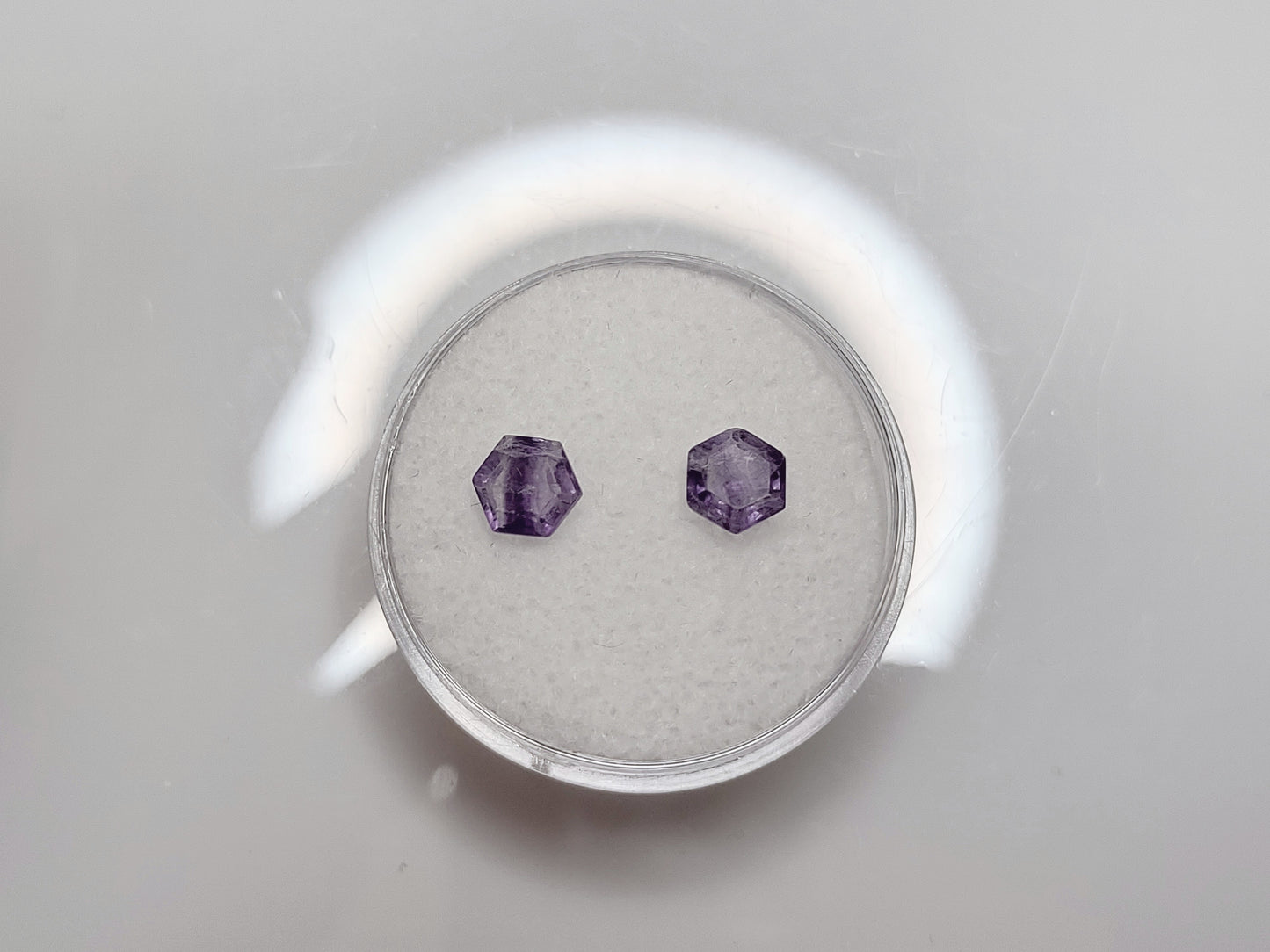 Two small 5x5mm hexagon cut purple and lavender striped fluorite gems.