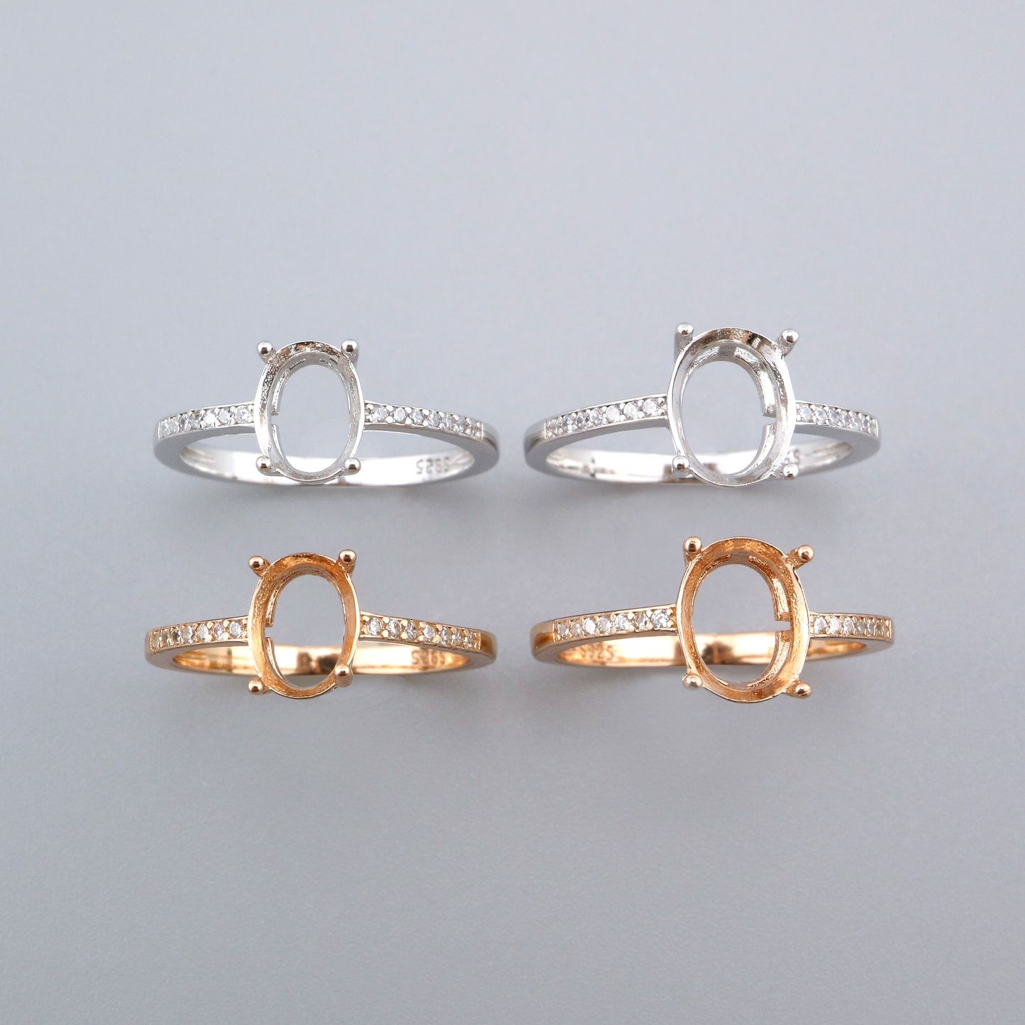 Two silver and two rose gold oval pave shanked semi mount.