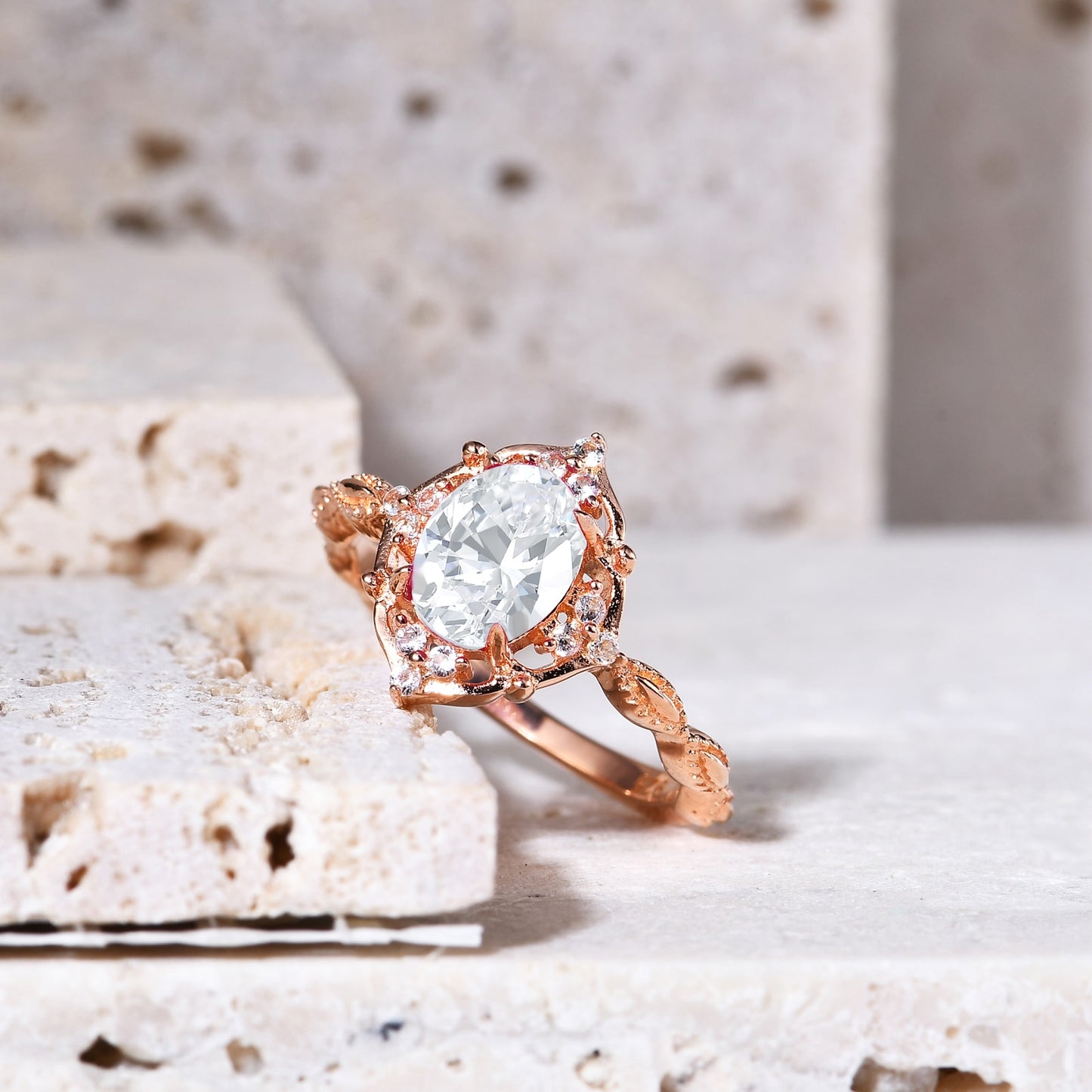 Solid rose gold vintage style halo engagement ring set with an oval cut moissanite.