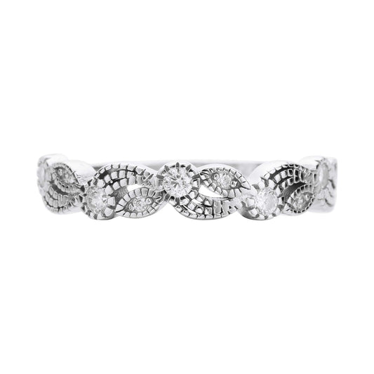 A silver swirl and leaf designed band set with clear small gems.