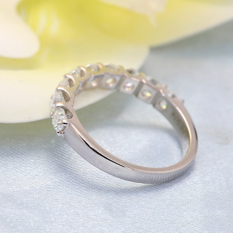 A silver half eternity wedding ring.