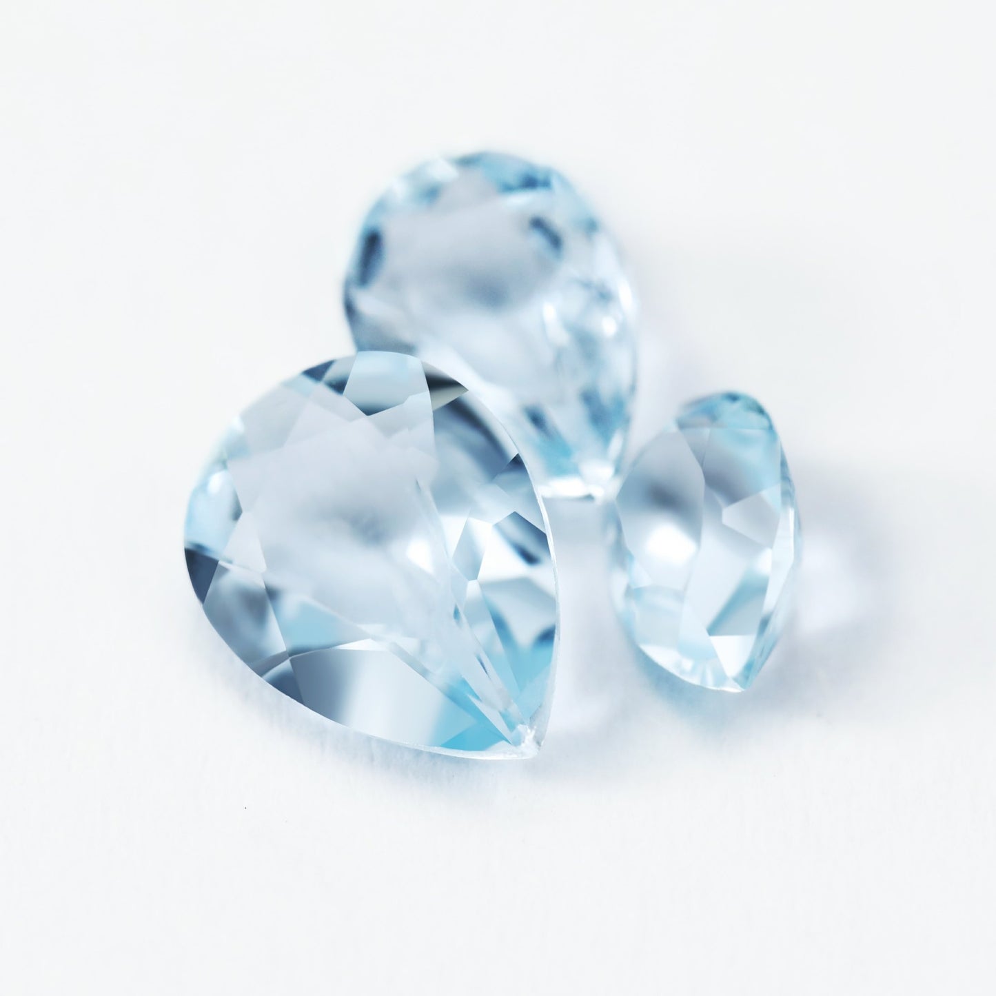 3 tear drop cut light blue aquamarine gems.