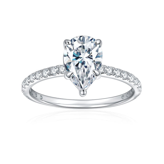 A silver tear drop cut moissanite engagement ring on a pave shank.