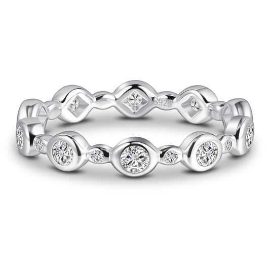 A silver bezel set eternity ring.