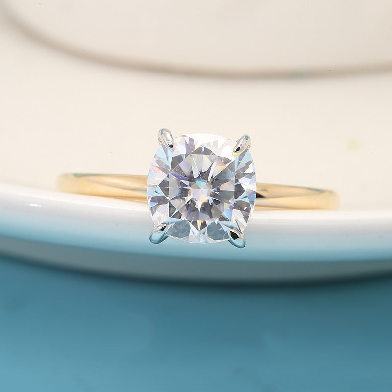 Solid yellow gold round cut moissanite hidden halo engagement ring.