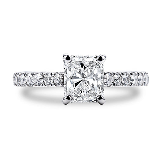 A sterling silver radiant cut moissanite set in a moissanite hidden halo and pave band.