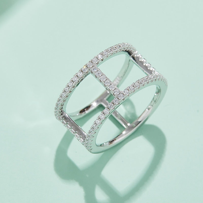 A silver double band moissanite ring.