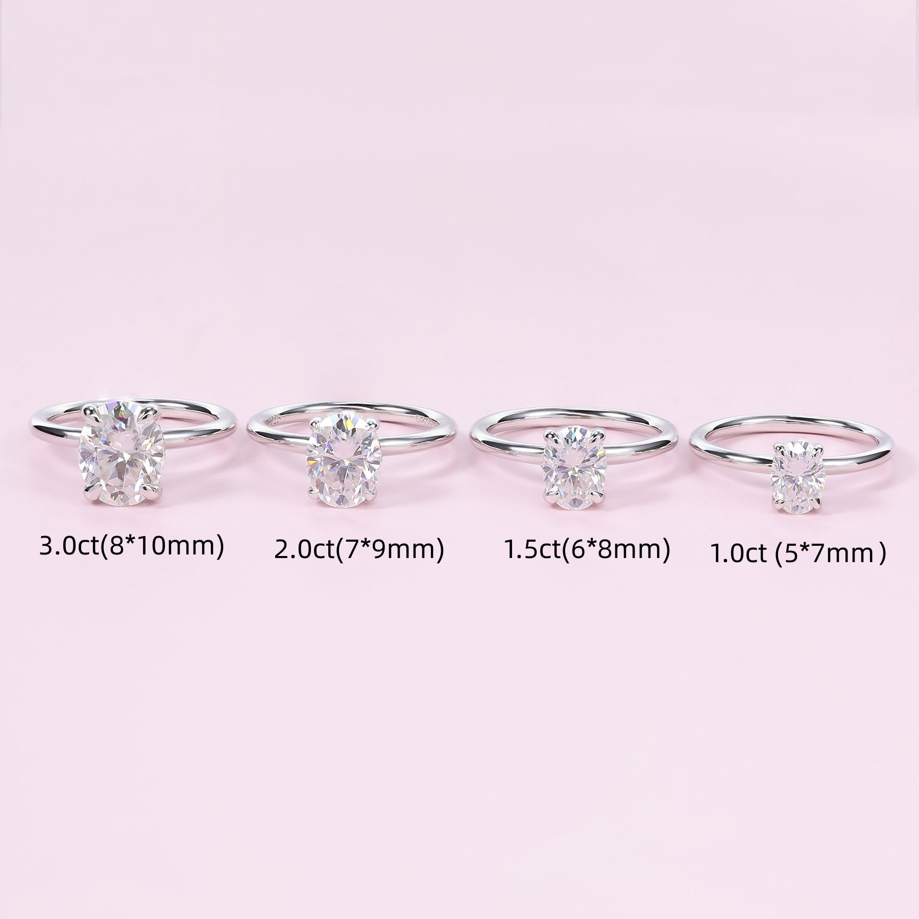 Four silver oval cut hidden halo engagement rings of varying stone sizes.